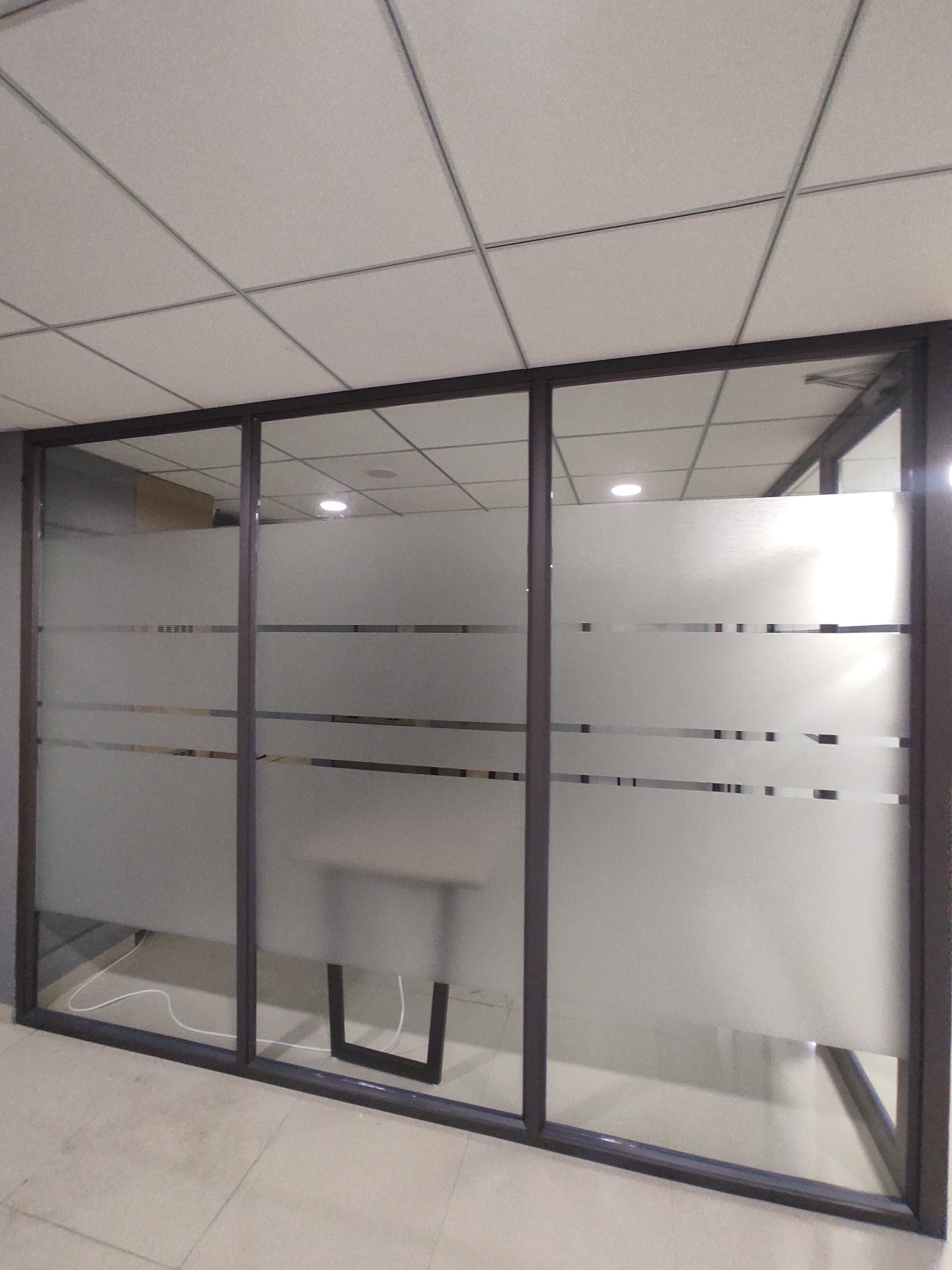 Team cabin enclosed by frosted glass partitions